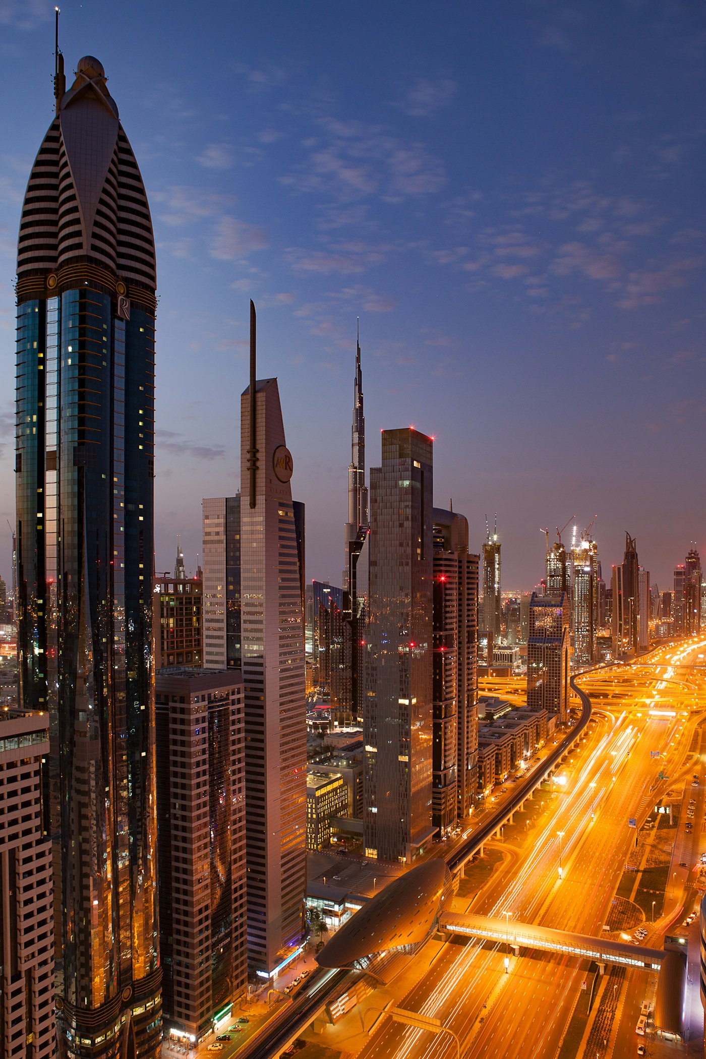 Dubai skyline along Sheikh Zayed Road at twilight
